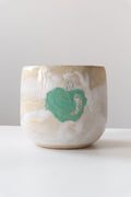 Cup called “green apple juice”