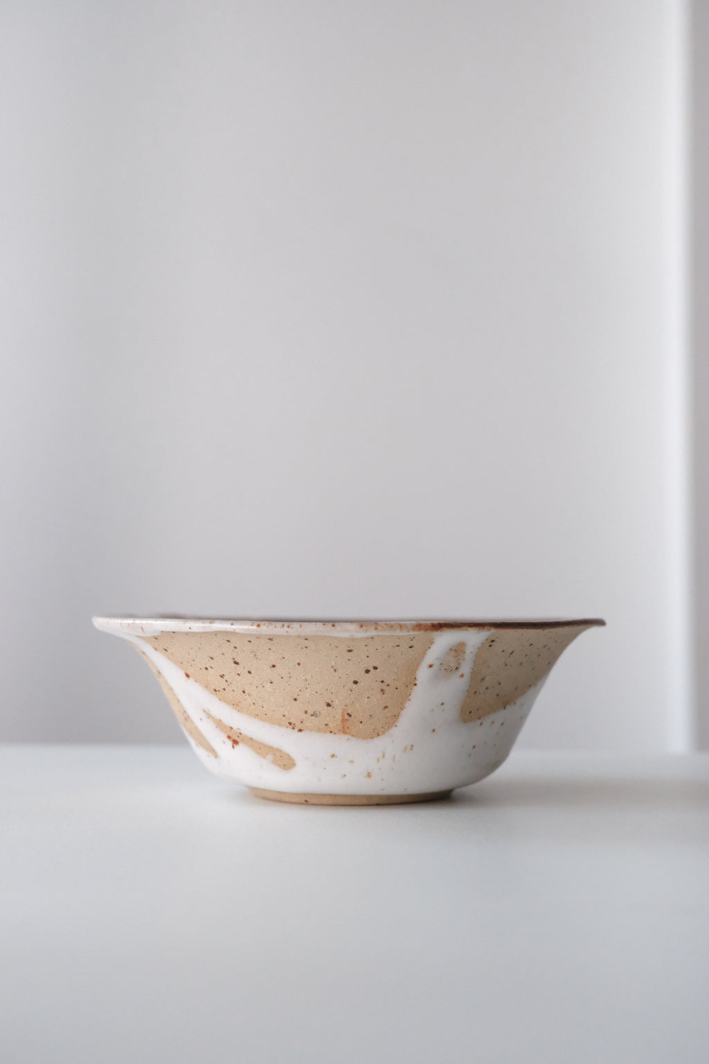 Bowl called “tree, daisy and house hiding from something”