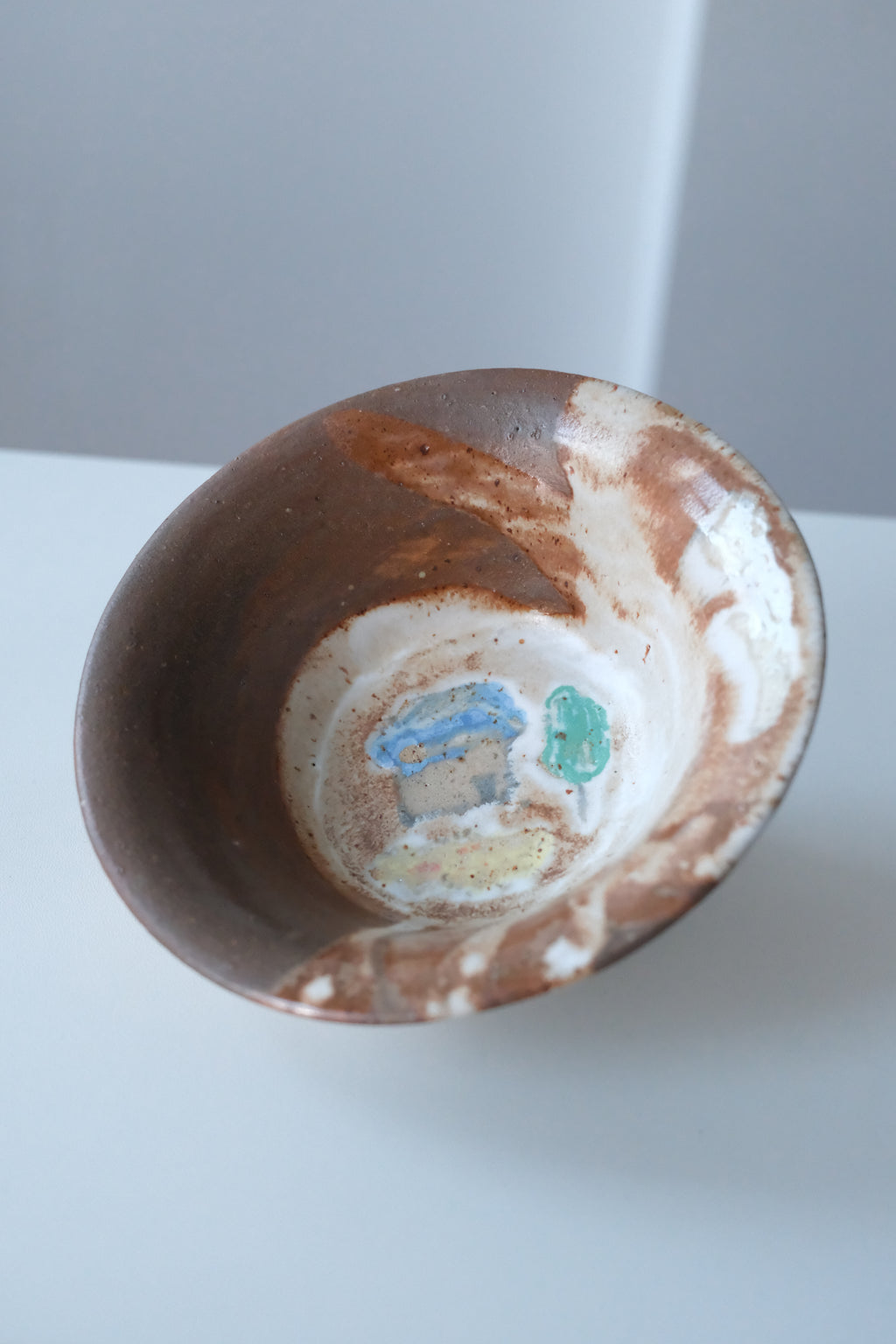 Bowl called “tree, daisy and house hiding from something”