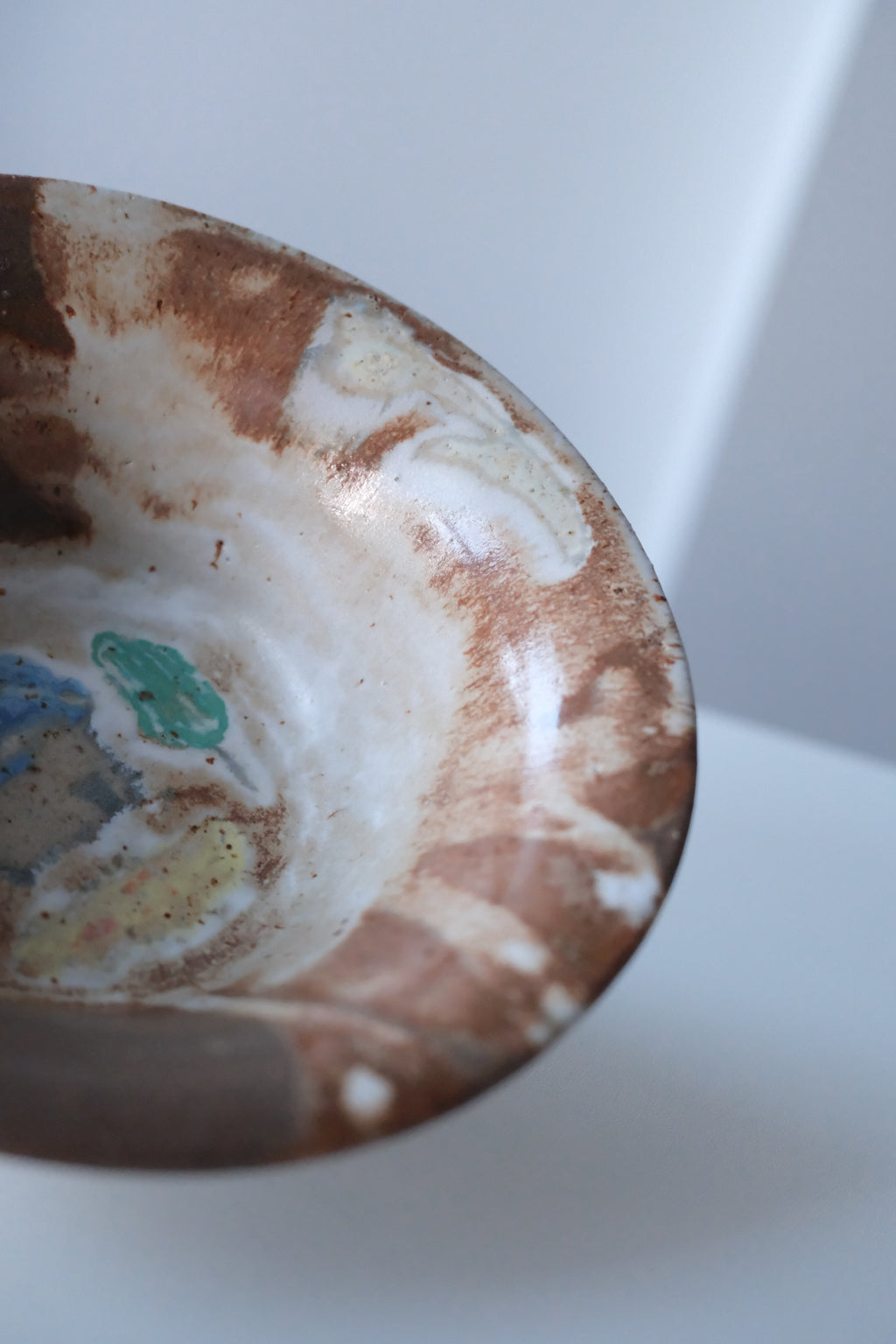 Bowl called “tree, daisy and house hiding from something”